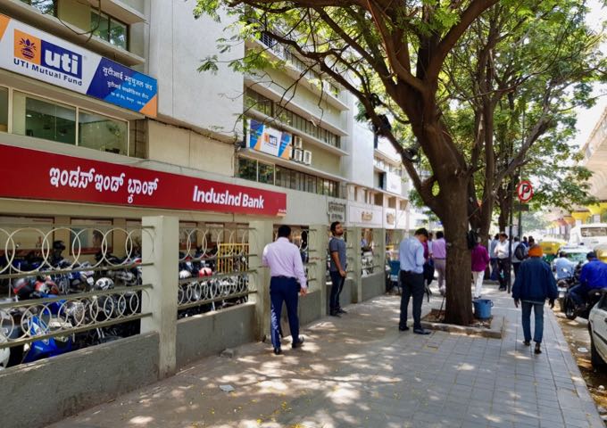 The shady M.G. Road near the hotel is lined with banks.