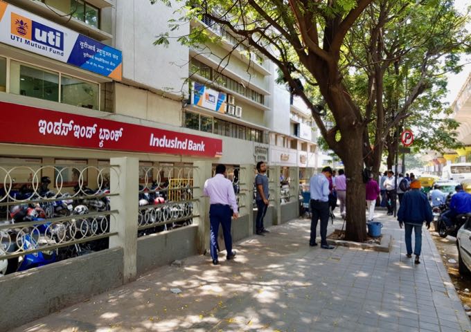 The shady M.G. Road near the hotel is lined with banks.
