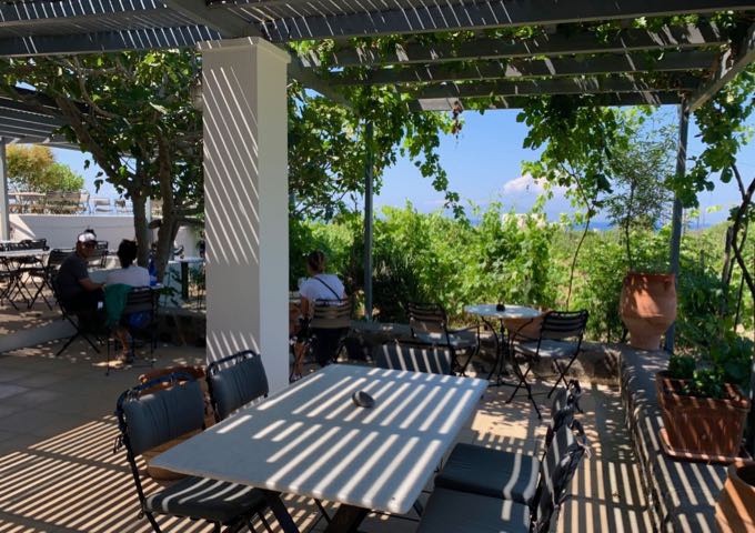 Shaded seating area in Domaine Sigalas Winery 
