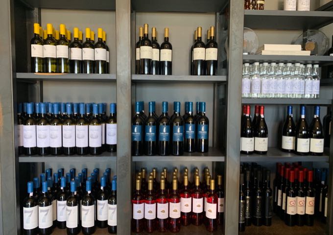 Shelves of wine for purchase at Domaine Sigalas Winery