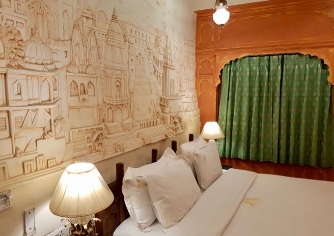 The mural over the bed in the Varanasi-themed room is hand made.