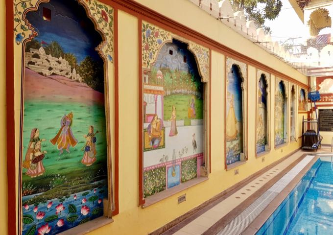 The pool features attractive traditional murals on the walls.