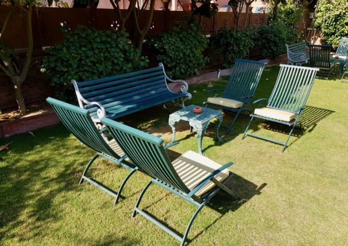 Guests can enjoy the sun or a gin and tonic on the hotel lawns.