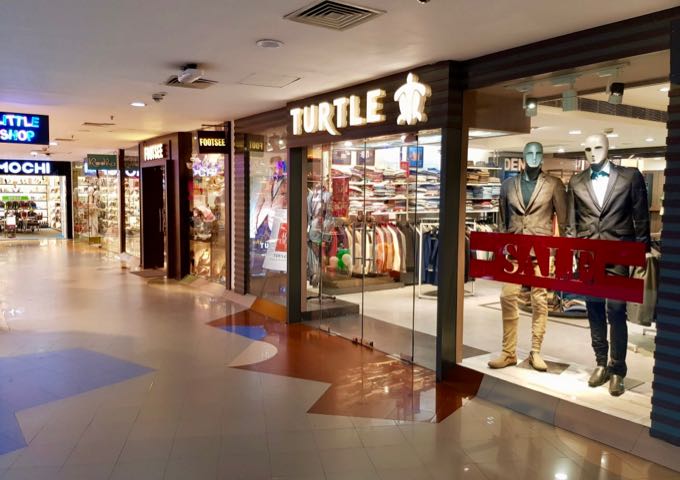 There are several boutiques in the air-conditioned mall.