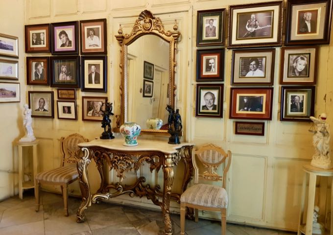 The guesthouse is filled with antique furniture and photos.