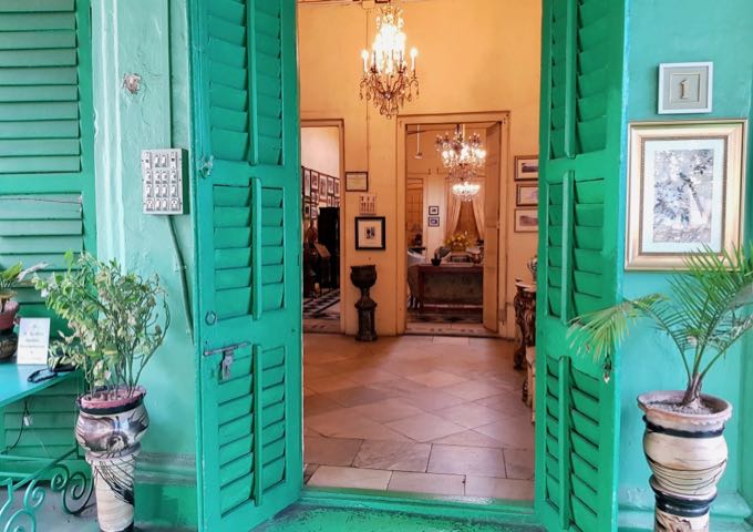 The guesthouse maintains the same green tone, style, and decor throughout.