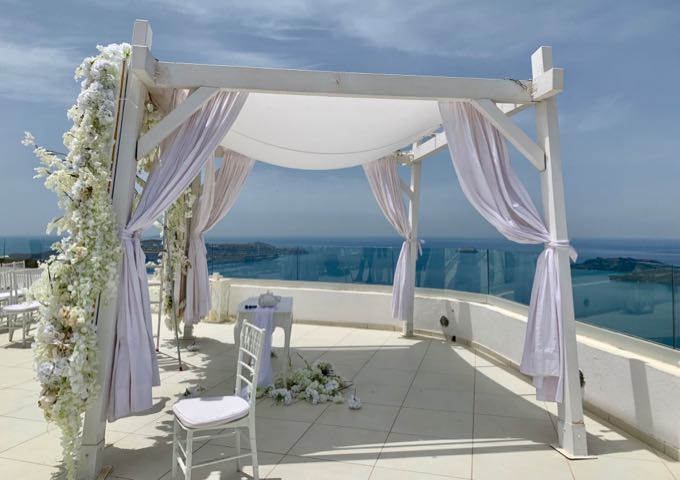A flower-strewn wedding canopy at Santo Winery