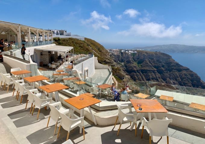 Cliffside tables at Santo Winery in Santorini.