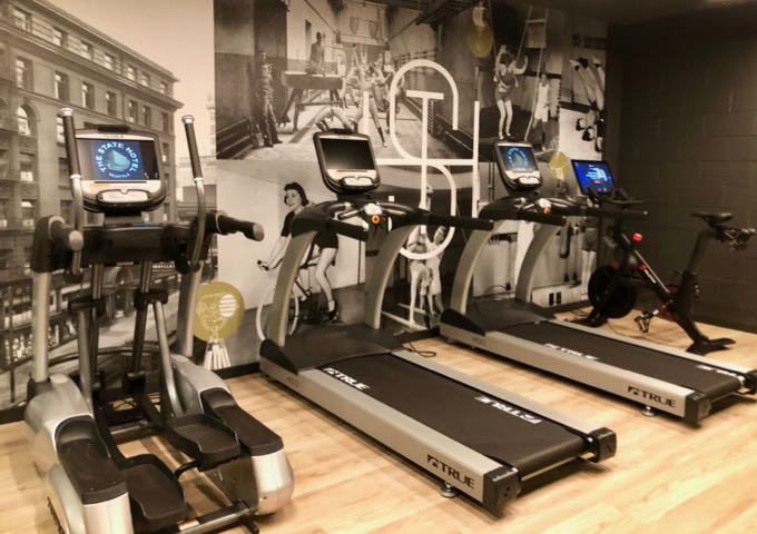 Treadmill and elliptical machines and stationary bike in the State Hotel's fitness center