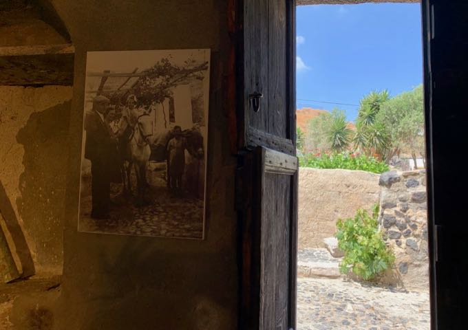 Old family photograph displayed on a rustic wall