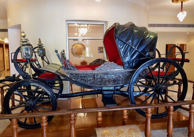The lobby features a full-sized horse carriage.