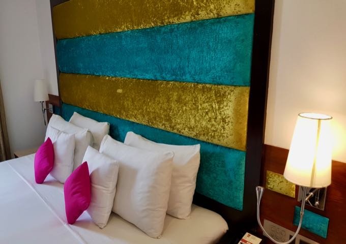 Rooms have a bright decor and comfortable beds.