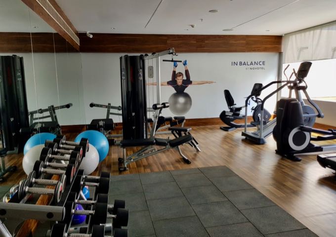 The rooftop gym is well-equipped and faces the pool.