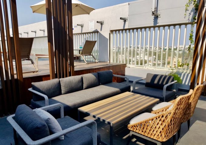 The rooftop has plenty of pool-facing seating.