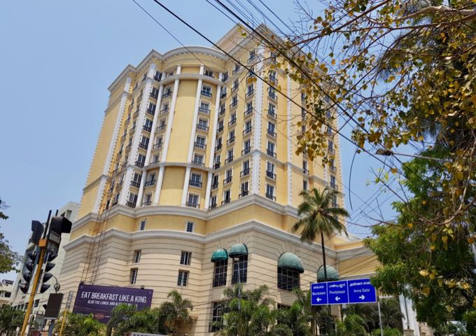 The imposing hotel is located in a shopping district.