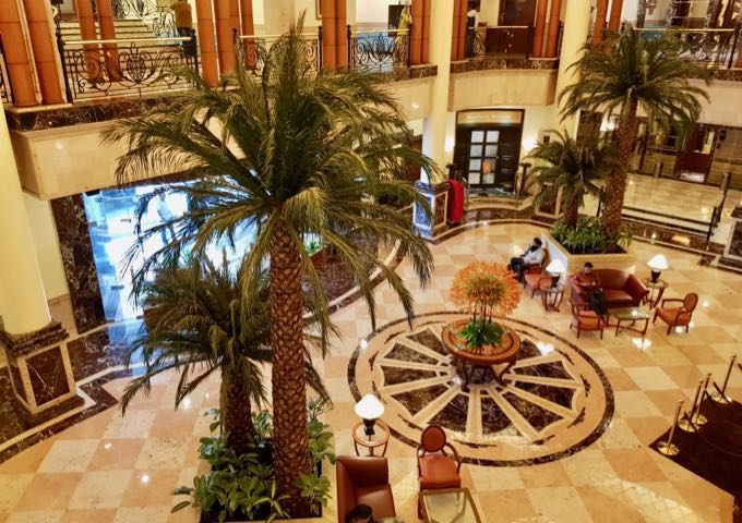 The opulent lobby features fake palms.