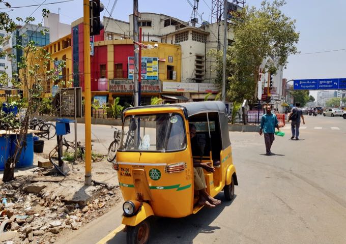 The area has several auto-rickshaws.