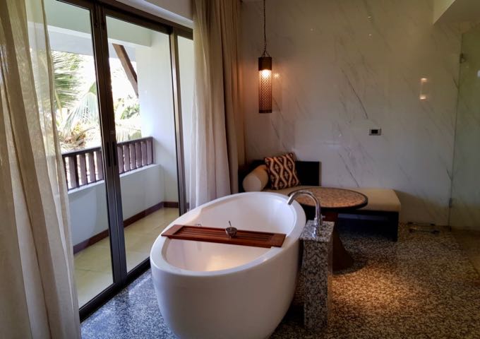 Most suites feature stand-alone bathtubs with garden views.