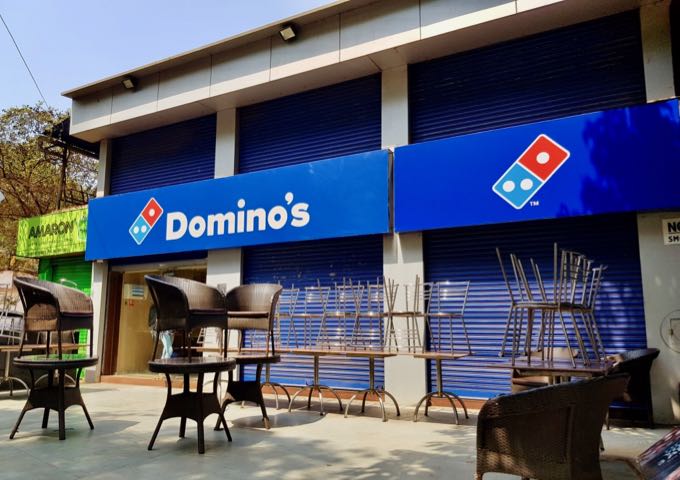 A Domino's outlet is just past Sher-A-Punjab.