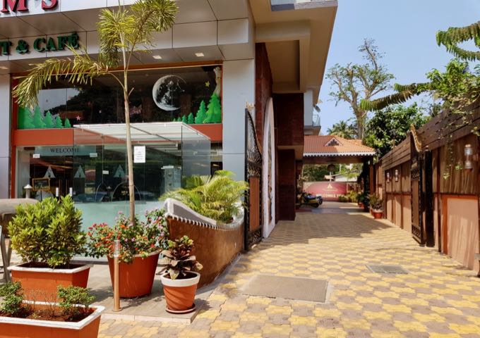 The small entrance is on the hotel's side.