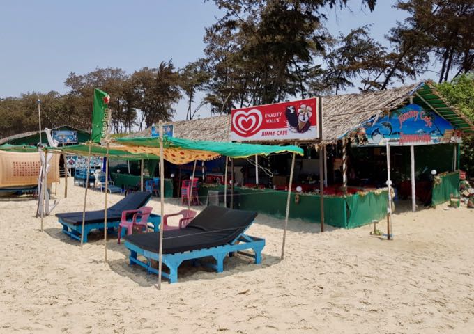 There are several shacks on the beach.