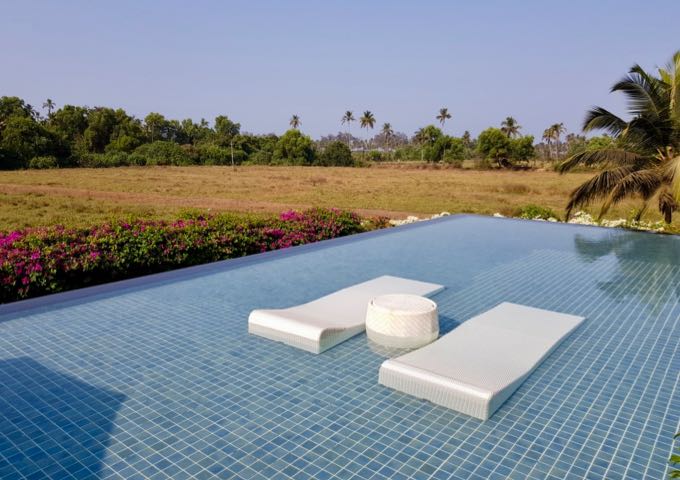 Alilia Diwa's infinity pool has submerged sunbeds.