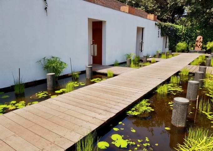 The spa's treatment rooms are connected via a boardwalk among ponds.
