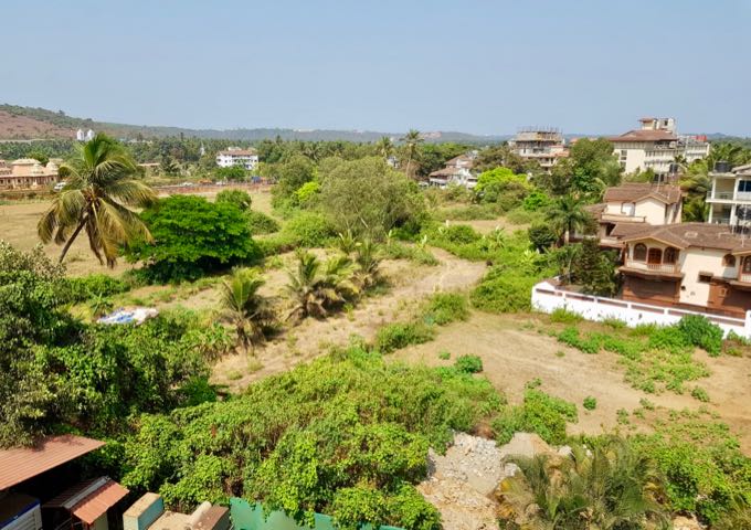 The hotel is located in Candolim amongst farms.