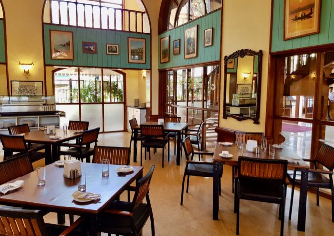 The bright Orchid Restaurant features prints on the walls.