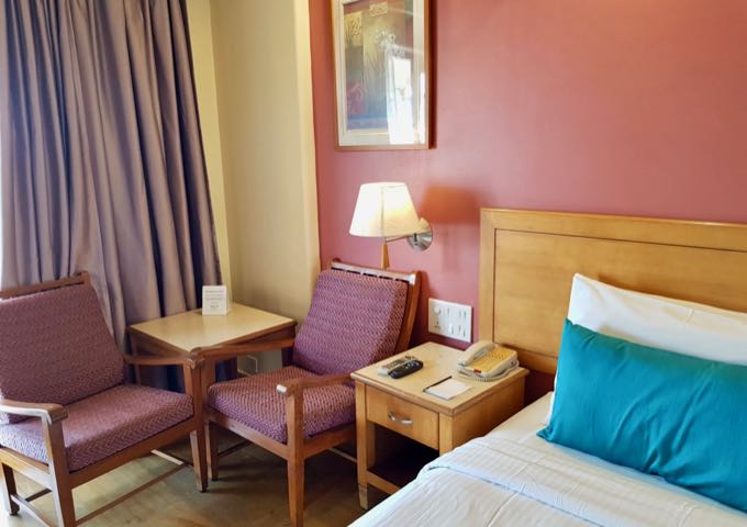 The spacious rooms and suites feature sitting areas.