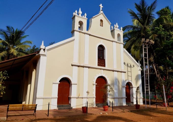 A Portuguese-style church is located near the beach/