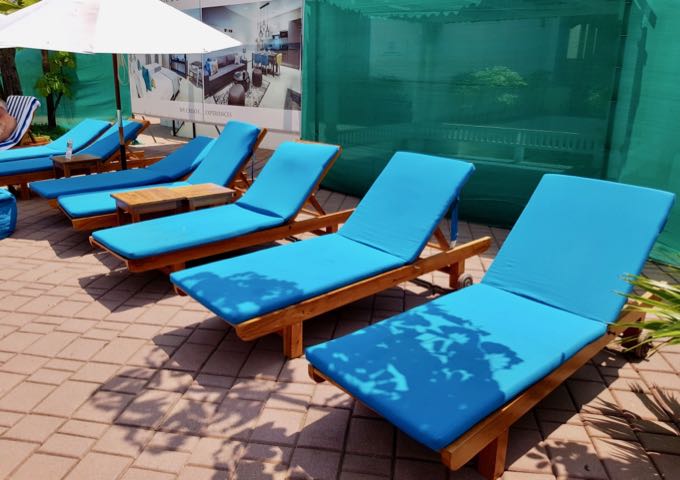 The pool deck has some sunbeds.