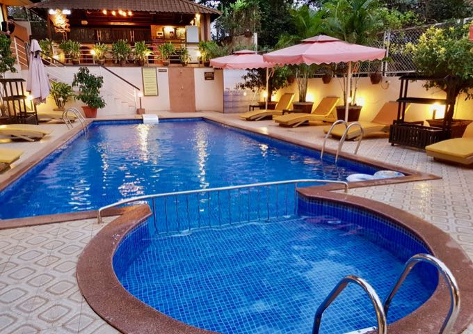The larger pool has plenty of sunbeds and shade.