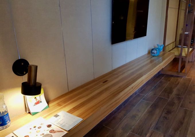 Rooms feature extra-long table-cum-desks.