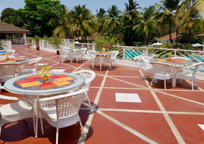 The Amalia bar offers outdoor seating on a terrace overlooking the pool.
