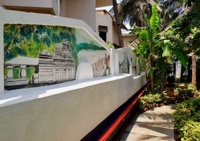 Garden paths with murals of old Goa connect all accommodations.
