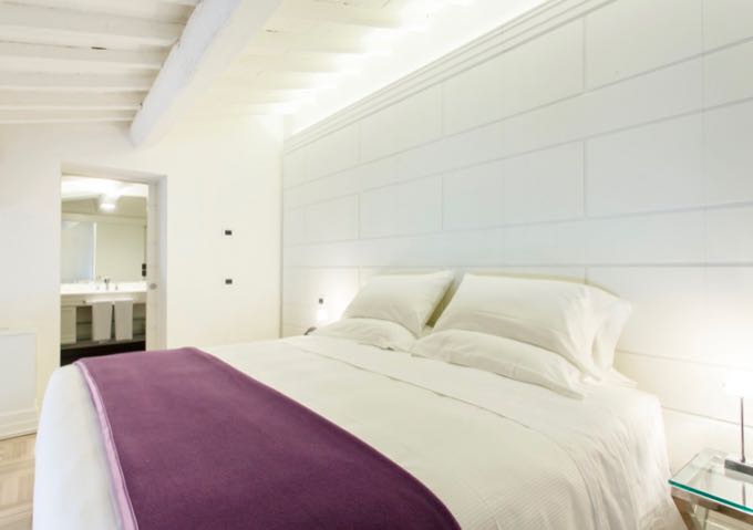 Luxury hotel room with all-white furnishings