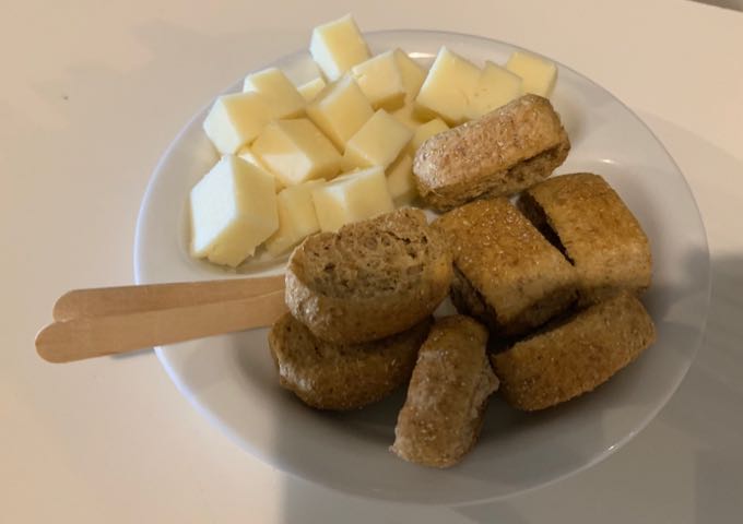 Cubed cheese and barley rusk bread on a plate