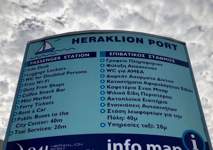Sign listing the amenities at the Heraklion Port passenger station.