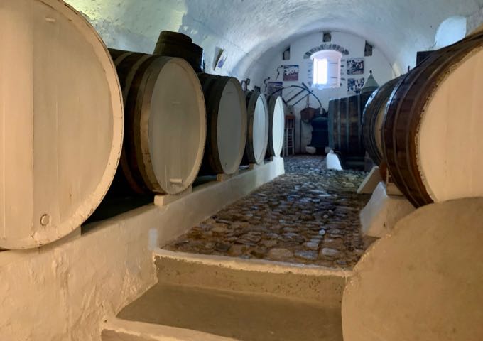 Old wine barrels in a cave-like room 