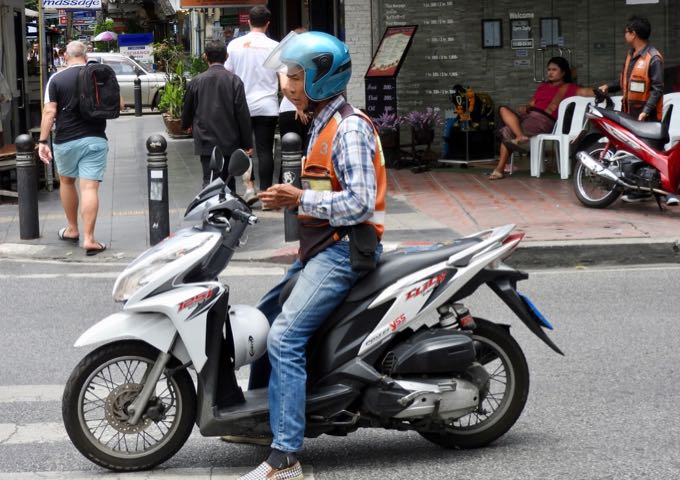 Motorcycle taxis are a quick way to get around Bangkok.