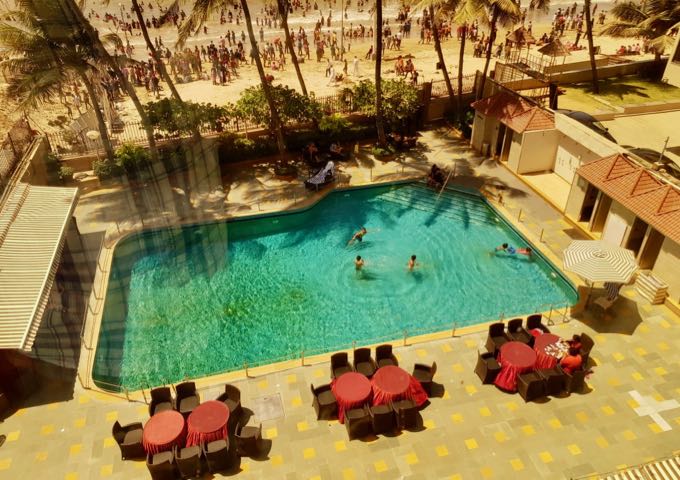 Swimming pool and seating at Ramada Plaza.
