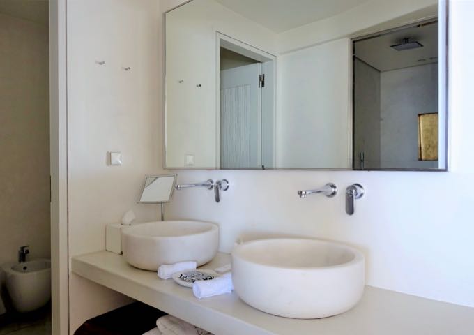 The suite's bathroom has dual vanities.