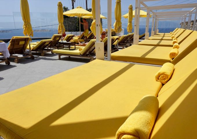 The sun terrace has several single and double sunbeds.