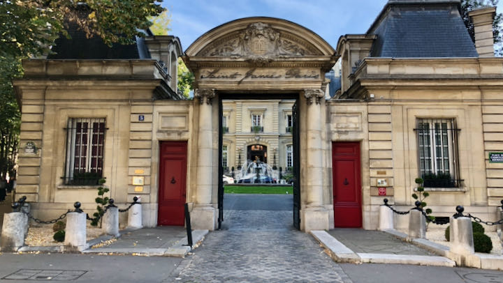 Stone gated entrance to Saint James Hotel in Paris