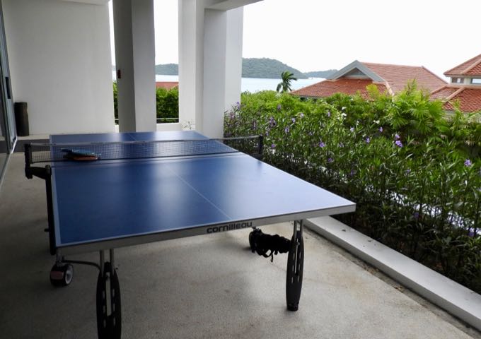 There is a ping pong table outside the gym.