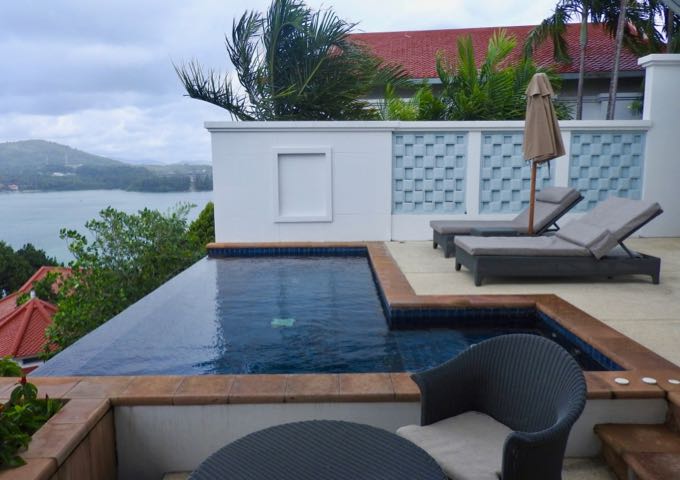 The patio has a large infinity pool with jacuzzi, sunbeds, and outdoor dining and barbecue area.