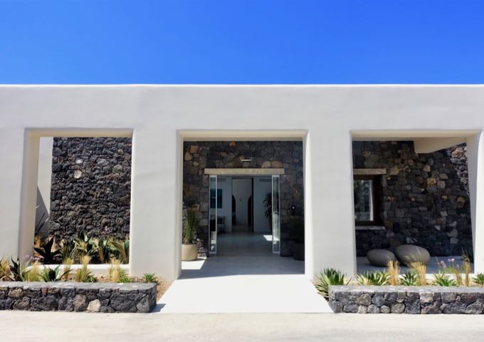 The entrance sports a modern, cycladic architecture.