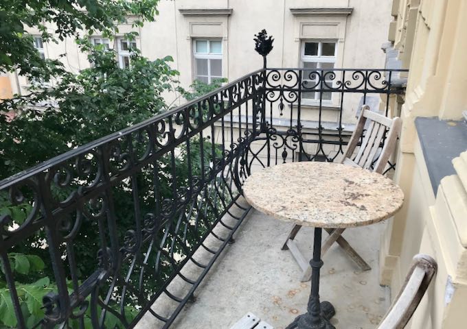 Rooms feature small terraces overlooking the square.