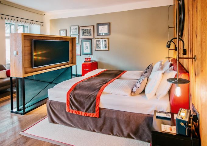 Rooms feature large flat screen TVs.
